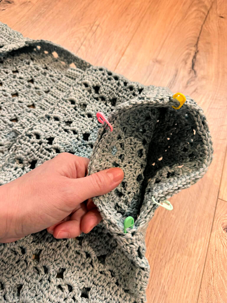 Making a blue summer crochet cardigan.