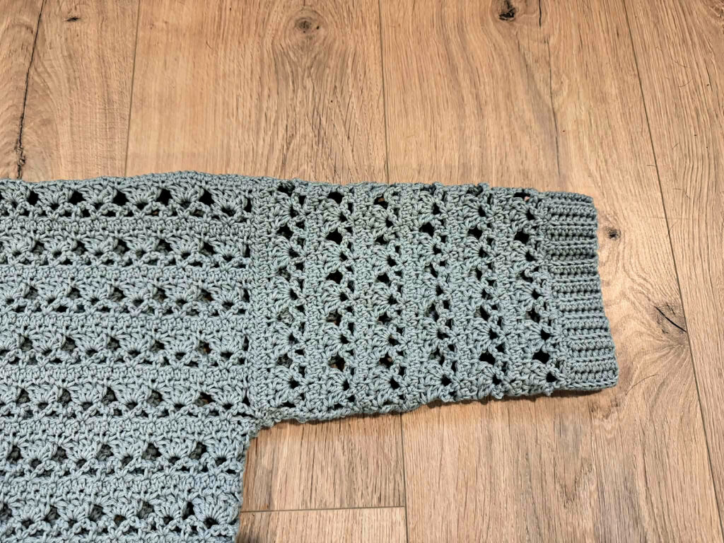 Making a blue summer crochet cardigan.