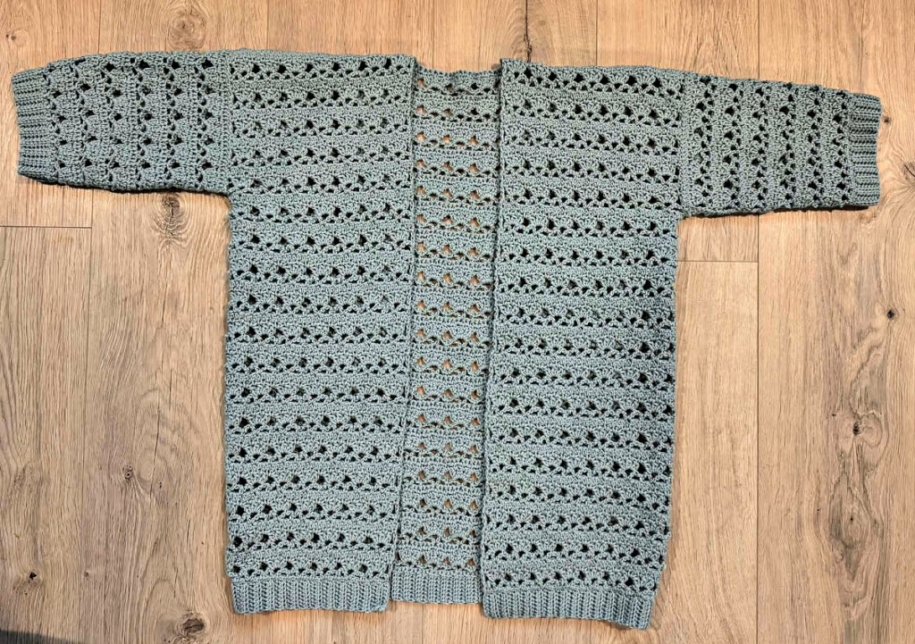 Making a blue summer crochet cardigan.