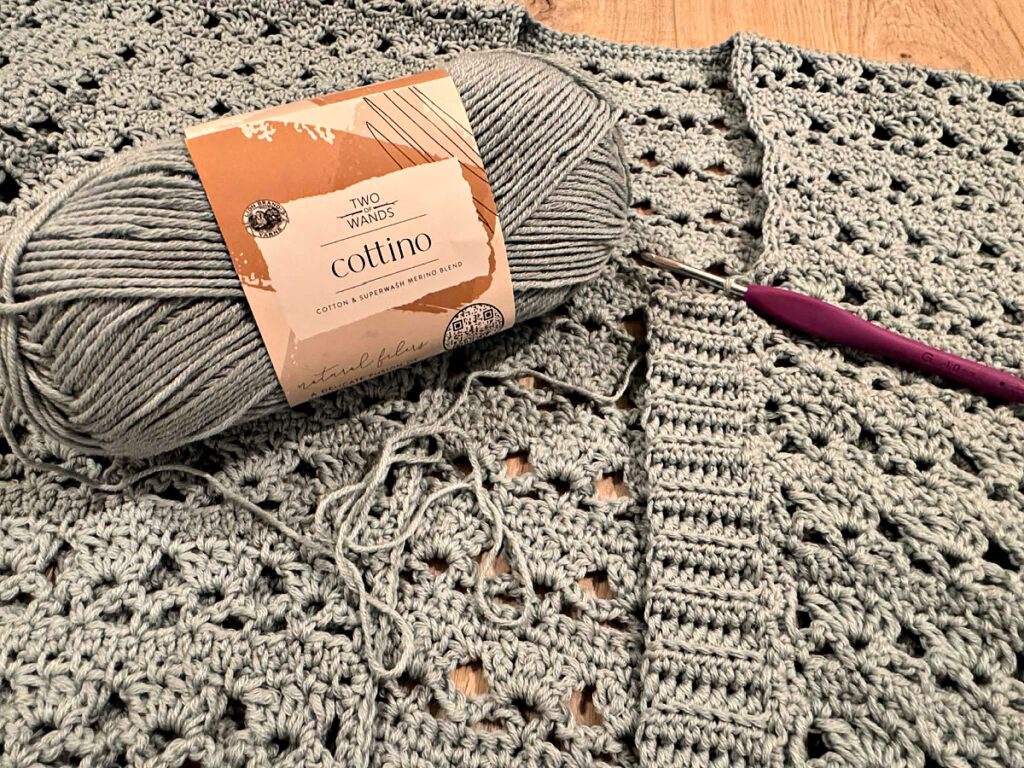 Making a blue summer crochet cardigan.
