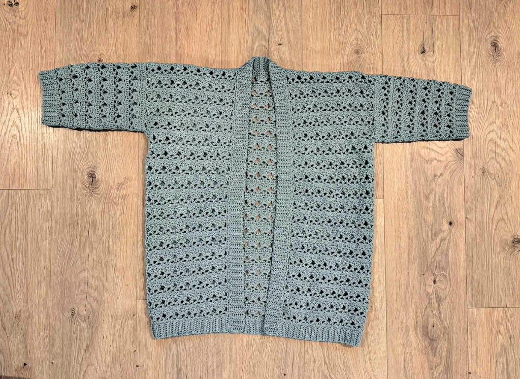 Making a blue summer crochet cardigan.