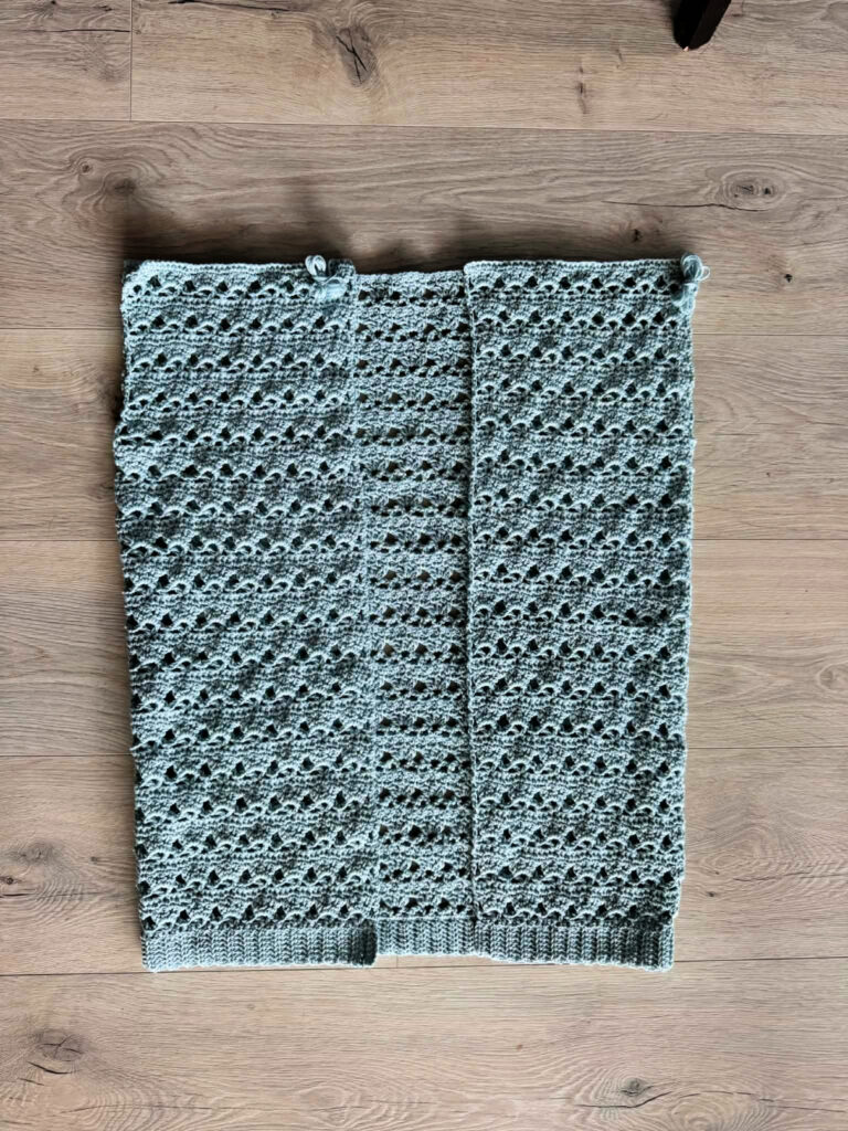 Making a blue summer crochet cardigan.