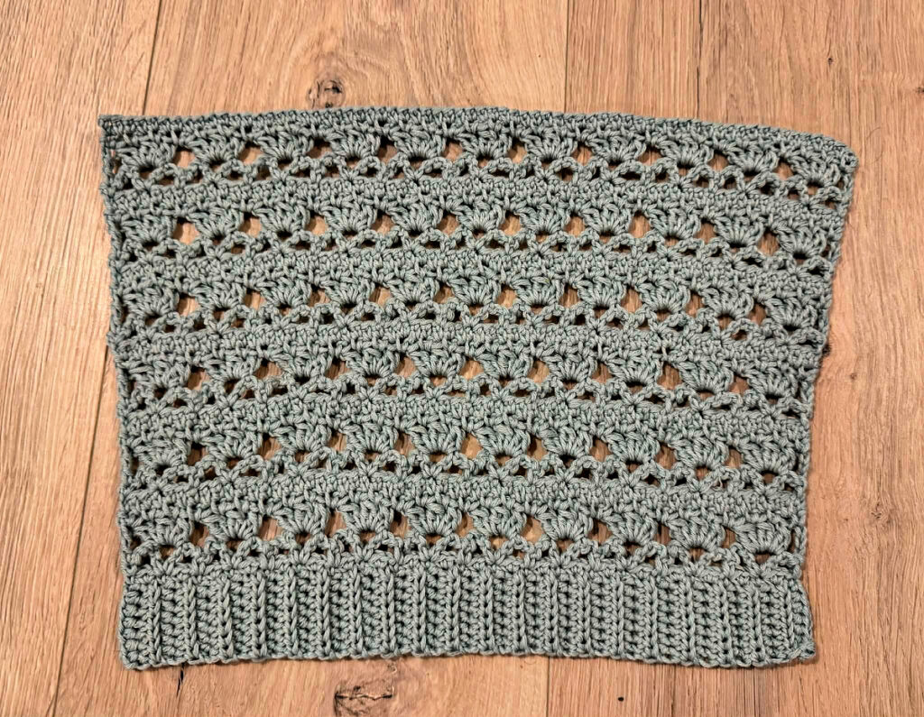 Making a blue summer crochet cardigan.