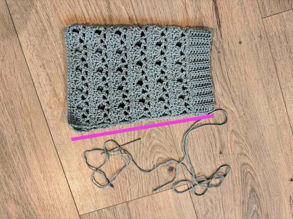 Making a blue summer crochet cardigan.